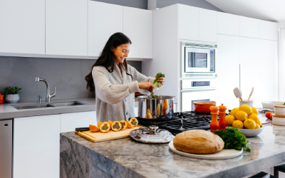 Woman smiling making dinner